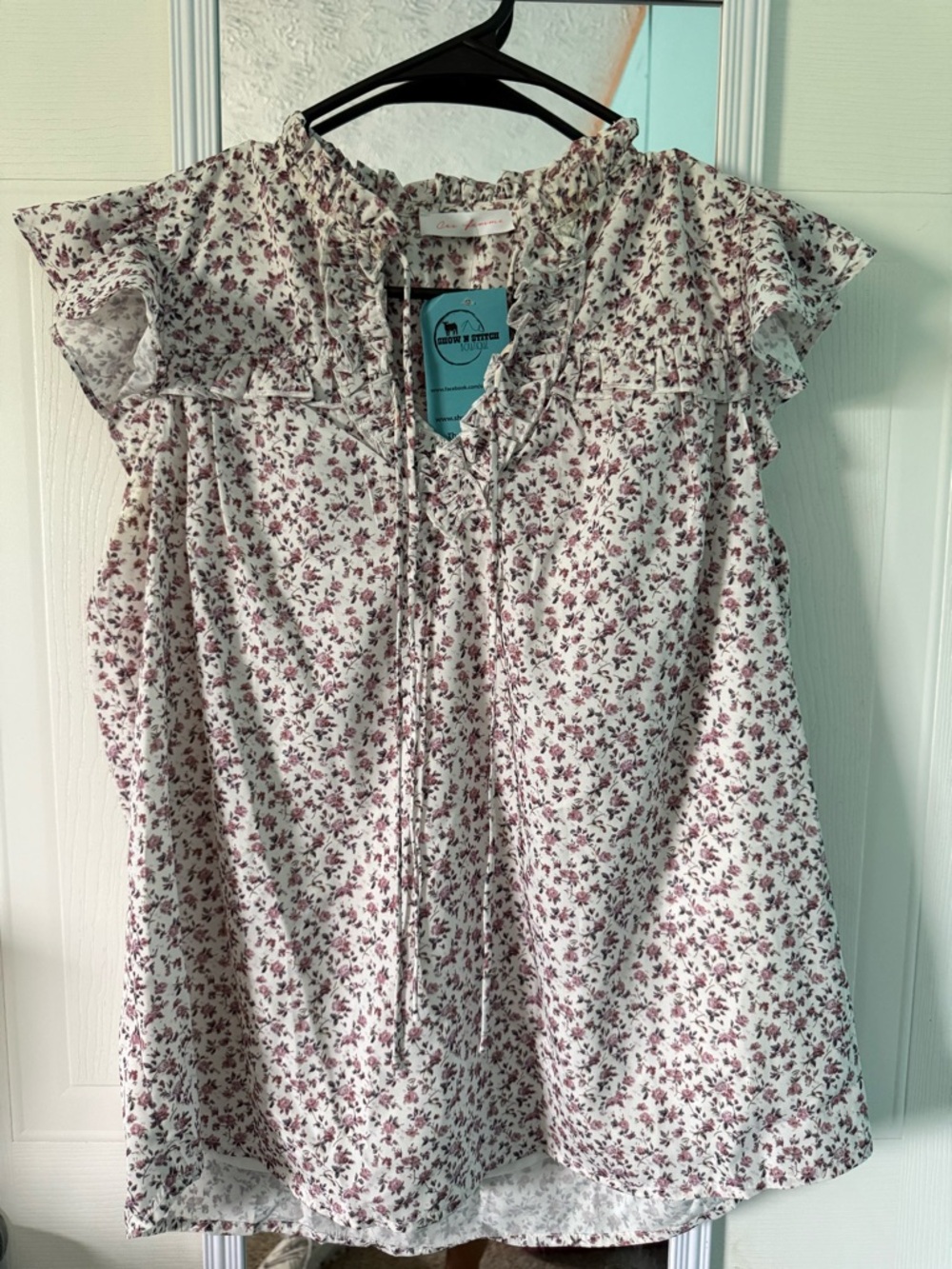 Ces Femme Ivory Sleeveless Floral Tie-Neck Blouse with Mauve Print
